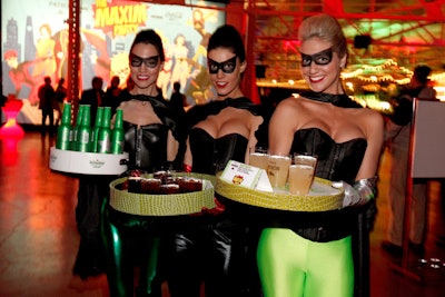 Playing off the event's superhero theme, staffers at Maxim's 2012 Super Bowl party in Indianapolis wore capes, skintight leggings, and mask-like makeup.
