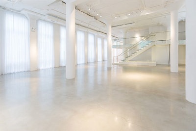 Statuesque columns activate the seventeen-foot-tall interior.
