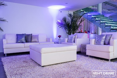 A contemporary lounge setting underneath the mezzanine at Chez