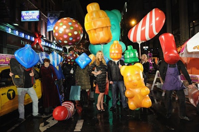 Actors dressed as Candy Crush Soda Saga game pieces as part of the mobile game's launch. Actress Molly Simms (pictured, center) also attended the event.