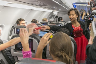 MasterCard partnered with American Airlines to surprise passengers with a showing of Annie before the film hit theaters. The screening was followed by an in-air meet and greet and Q&A session with guests from the film, including star Quvenzhané Wallis (pictured).