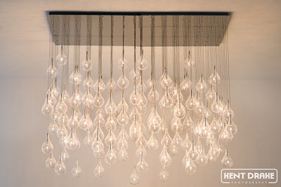 144 Delicate Pendants Make Up This Contemporary Chandelier At The Chez Entrance