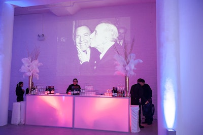 Images projected onto the white brick walls at Chez.