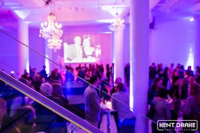 The Chez grand opening party with chandeliers and projection.