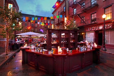 A 360 degree bar helped to satisfy thirsty guests while overhead, a laundry line featuring corporate messaging on colorful tees were a playful addition