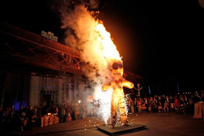 Guests were invited to pin their desires to an 18’ custom constructed Voodoo doll, that was set ablaze as dancers performed to ancient drums