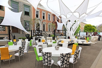 In 2014, tension fabric rigged from rooftops and lounge groupings with charging stations for iPads and phones, made Brownstone Street a digital, modern set