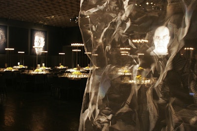 When the Whitney Museum of American Art honored Chuck Close at its 2007 gala, the artist requested the organizers use gray as the event's primary color. In the dining room, event designer Geoff Howell installed crumpled curtains of metal mesh, which helped accentuate the large black-and-white portraits hung on the walls.