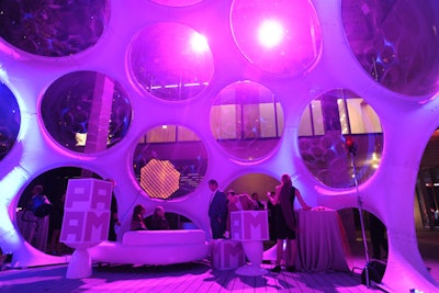 The Geodesic Dome was illuminated in the museum's West Portico, doubling as a photo backdrop for guests interested in printed souvenirs at Remix, the samba-themed dessert party.