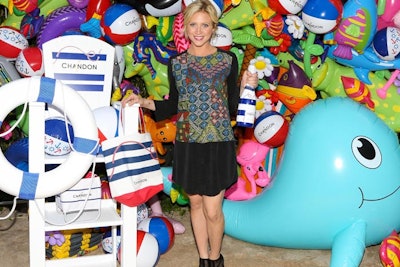 In 2013, Chandon hosted its American Summer Soiree in New York with a step-and-repeat backdrop that included a dense collection of inflatable pool toys, including those in shapes of blue whales, pink flamingos, and flowers, alongside logo beach bags, balls, bottles, and chairs.