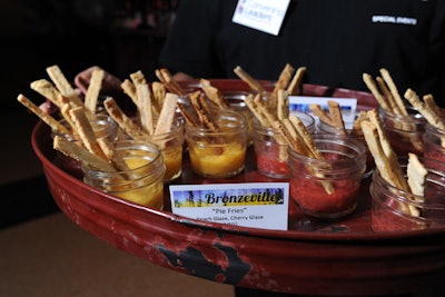 The museum's lower level was built out to reflect the Bronzeville neighborhood. Entertainment included a blues performance from Wayne Baker Brooks, and snacks included peach and cherry 'pie fries' that combined strips of crust with jars of fruity toppings.