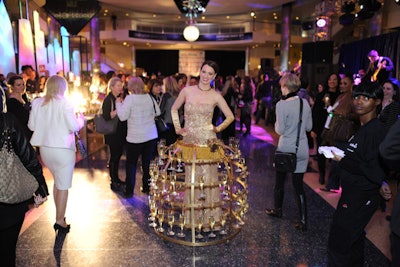 The entry hall was inspired by the Magnificent Mile. Entertainment included a 'champagne skirt diva,' whose costume held flutes of the bubbly beverage.