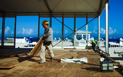 Amid lounging sun bathers, TOCA’s tent installation is underway for our event on South Beach.