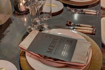 At the same Austin event in November, dark gray menu cards stood out against the pale table settings and flatware.