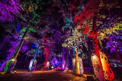 Synergy Event Production president Andrew Carroll, who was headlining artist String Cheese Incident's lighting designer for 16 years, curated nighttime lighting designs at Spirit Lake. They included illuminiating tall oak trees and Spanish moss, and projections onto the center lake.