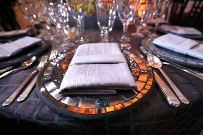 One of the smaller gallery spaces at the Phillips Collection featured steel gray linens topped with chargers with stone inlays for the museum's 90th anniversary gala, which was held at the Anderson House and the Phillips Collection in May 2011 in Washington.