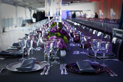 Slate gray linens were accented with green hydrangeas and dark pink, purple, and maroon roses at architecture and engineering firm McKissack & McKissack's 20th anniversary dinner, which was held at the Potomac View Terrace in Washington in September 2011. The company worked with Events by André Wells to design the celebration.