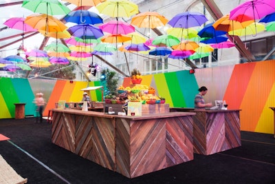 Outdoor custom bar surrounded by colorful floating umbrellas for this Brazillian themed after party (Google Global Partner Summit)