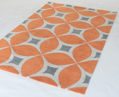 The orange and gray Trellis rug from Taylor Creative adds a little pop of color to a neutral setting, comes in two different sizes (5 by 8 feet, $300, or 7 by 9 feet, $400), and is available throughout the mid-Atlantic region.