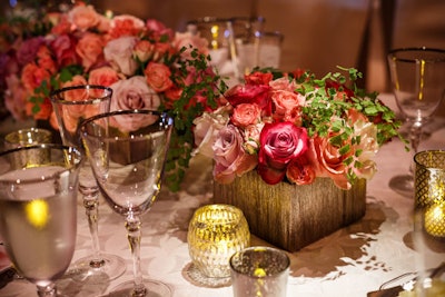 The floral arrangements on the tables included nine different varieties of roses in shades of blush, pink, and peach.