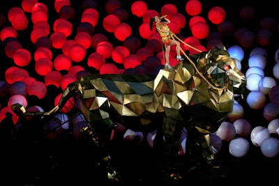 Producer reviewers praised the 2015 Super Bowl halftime show's level of technical production, including Perry's opening, which saw the entertainer ride in on a metallic animal.