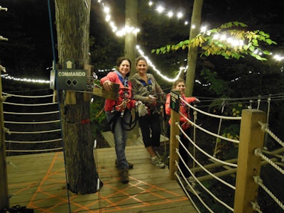 Three women adventurers out for a night climb at The Adventure Park