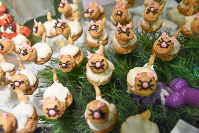 The catering department had a table buffet with a variety of animal-shaped sweets like puff pastry kittens.