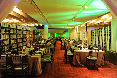 Dinner tables were set up among the library stacks.