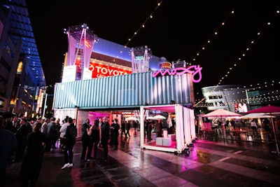 Container-based structures housed an open-air bar and a hotel room mock-up at the Los Angeles launch events.
