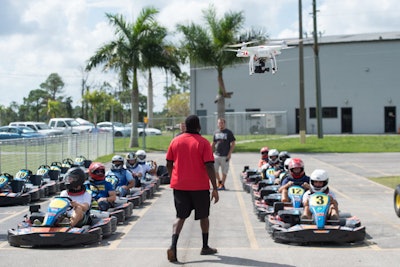 Drones can be useful to capture images of events that involve action, such as a teambuilding outing at a racetrack.