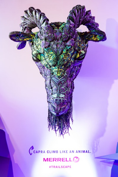 In the product display area, a sculptural goat head made from Merrell's Capra hiking boots was a popular photo backdrop.