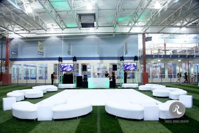 The Field House transforms into an expansive dance floor with unique furniture arrangements and a DJ booth.