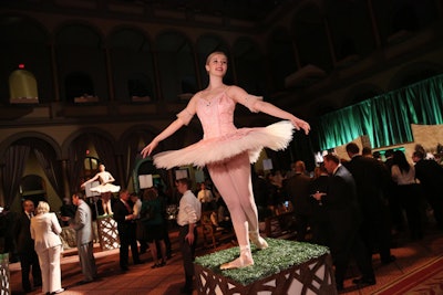 Ballerinas from the Washington Ballet Company posed on pedestals as living statues at the entrance to the event.