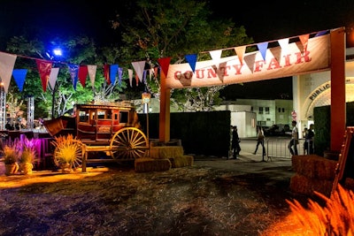Held in a transformed parking lot venue, the premiere party's theme evoked a county fair. Props included a 1920s-era stagecoach.