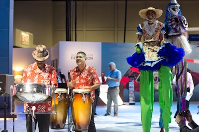 Caribbean music and stilt walkers entertained guests at the Sikorsy booth, where executives recognized one of their long-standing customers, N.H.S.L., which is based in Trinidad and Tobago.