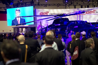 Crowds gathered at the Bell Helicopter booth to hear from C.E.O. John Garrison and to learn about the company's newest product.