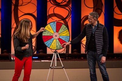 TEDActive hosts Kelly Stoetzel and Jay Herratti warmed up the crowd with a Truth or Dare wheel in keeping with this year's conference theme. Attendees could spin the wheel and land on truth or dare, or win a prize.
