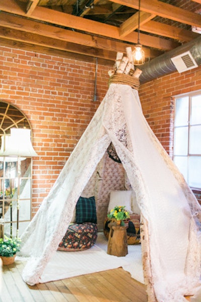 Weiss designed a luxe teepee setup, which included cushions from Found.