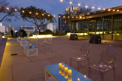 Rooftop garden night view facing east, cocktail reception setup.