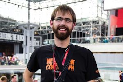 An experienced event professional prepares to welcome the crowds at New York Comic Con.