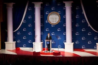 Mitt Romney speaks to a crowd at a political congress