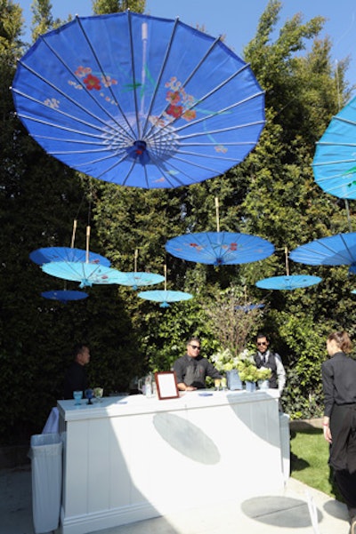 In February, Mindy Weiss and Wedding Paper Divas feted their social stationery collaboration with a Los Angeles party meant to show off specific wedding trends represented in the new collection. Among them was Chinoiserie, represented at the event in an area decked with upturned blue parasols strung overhead.