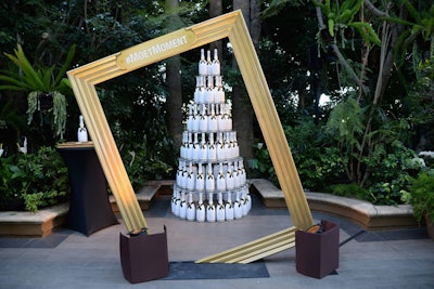 A photo op let guests pose with a tower of champagne bottles and a tilted frame with the hashtag #MoetMoment.