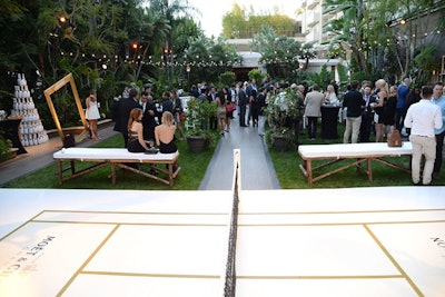 Twinkling bistro lights hung over the court, which was decked in Moët & Chandon's signature gold-and-white hues and the brand's logo.