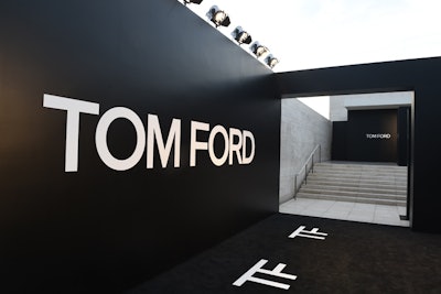 Ford's team transformed the 3,000-square-foot entrance pavilion at Milk Studios and split it into two paths—one led V.I.P.s and celebrities to a 'black carpet' step-and-repeat with stark black walls and branded carpeting, while the other provided direct access into the venue.
