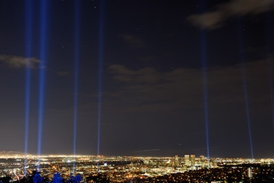 Guests at the V.I.P party watched as 27 spotlights along the 26-mile marathon route lit up the night sky.