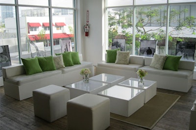 White seating area with green accent pillows