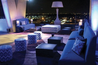 Custom blue lounge with patterned ottomans and side tables for event in Miami Beach