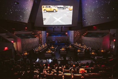 Performance hall plated dinner on the flat stage, no retraction with forward projection.