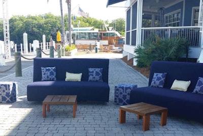 Navy Banquet sofas and nautical patterned ottomans and pillows